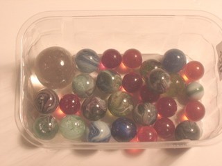 A small collection of various marbles