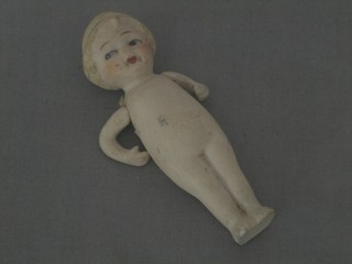 A biscuit porcelain figure of a child 4"