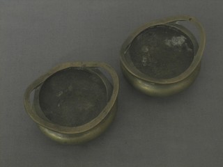A pair of Eastern bronze circular miniature twin handled cauldrons, the base with seal mark 2"