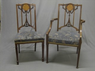 An Edwardian inlaid mahogany open arm carver chair together with a similar chair with upholstered seat, raised on square tapering supports