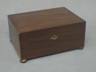 A Victorian rectangular mahogany jewellery box with hinged lid, raised on bun feet 11"