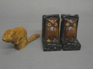 A carved figure of a Beaver 9" and a pair of carved wooden book ends