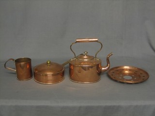 An oval copper kettle, an oval tankard, a copper egg poacher and a circular pierced dish 