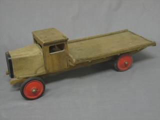 A wooden model of a flat bed lorry 22"