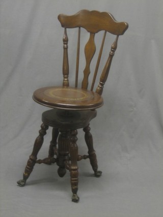 A Victorian carved oak harpists stool with stick and bar back