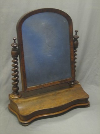 A Victorian plate dress table mirror of serpentine outline, contained in a mahogany frame supported by 2 spiral turned columns with large glove box, 26"