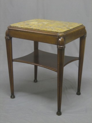 An Art Deco Continental walnut lozenge shaped 2 tier occasional table, the top inset a marble panel, with undertier, raised on turned and fluted supports 22"