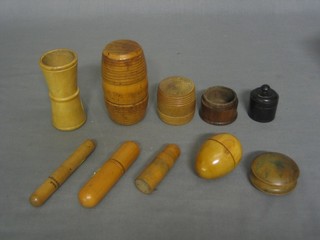A treen case containing a brass spirit level, 2 small treen cases containing glass phials, 2 olive wood nesting eggs, a wooden die shaker and 4 various wooden trinket boxes 