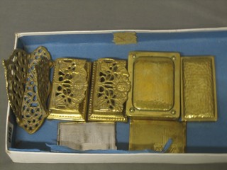 4 rectangular brass stamp cases, a pierced brass letter rack and 2 metal stamp cases