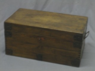 A rectangular pine trunk with hinged lid, iron banding and iron drop handles to the sides 24"