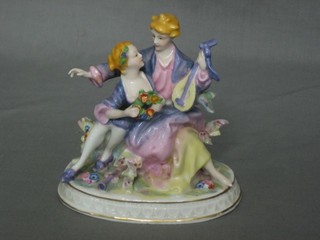 A porcelain figure group of a seated lady with mandolin and child 5"