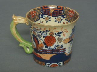 A Fenton Stoneworks mug, the handle in the form of a serpent, the base marked Fenton Stonework China No. 311, 4" 