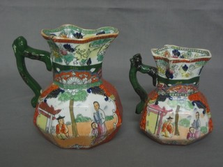 2 Masons octagonal jugs with chinoiserie decoration, the bases with black Masons mark 6" and 5 1/2" (1 with chip to spout)
