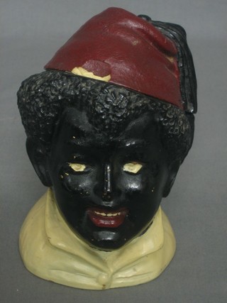 A 19th Century pottery tobacco jar in the form of a Blackamoor 6" (lid chipped)