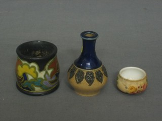 A circular Gouda match striker 2", a miniature Doulton club shaped vase 2 1/2" and a circular miniature Worcester bowl 1"