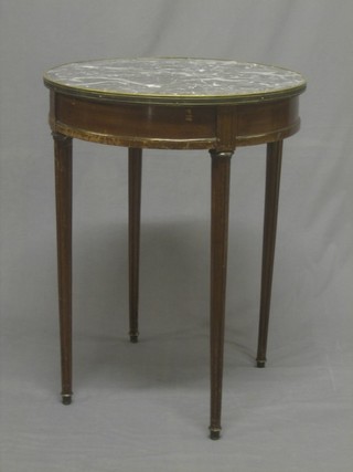 A Continental walnut circular occasional table with grey veined marble top, fitted a drawer and raised on turned and fluted supports 22"