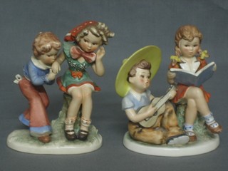 A Goebel figure of a seated girl and boy with book 6" and 1 other