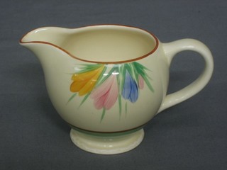 A Clarice Cliff circular pottery jug with floral decoration, the bae with gilt Clarice Cliff mark 3"