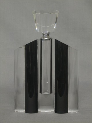 An Art Deco style glass scent bottle and stopper of triangular form 9 1/2"