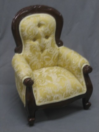 A childs Victorian style mahogany show frame chair, upholstered in yellow material and raised on cabriole supports