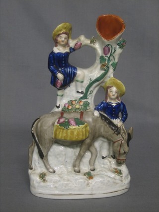 A Staffordshire arbour spill vase in the form of a lady, gentleman and donkey 9" (f)