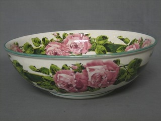 A Wemyss pottery wash bowl decorated roses, the base impressed and painted Wemyss (heavily cracked) 15"
