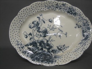 An oval blue and white meat plate with floral decoration 16"