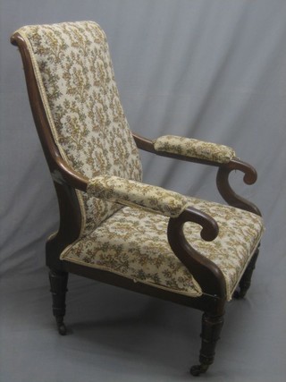 A  William IV mahogany open arm chair, raised on turned supports upholstered in tapestry material