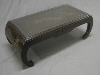 A rectangular Eastern carved hardwood coffee table, raised on scroll supports 35"