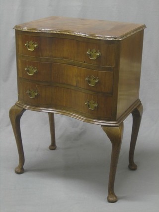 A Georgian style figured walnut chest of serpentine outline fitted 3 long drawers, raised on cabriole supports 20"