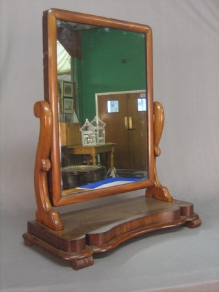 A Victorian rectangular plate dressing table mirror contained in a mahogany swing frame 23"