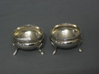 A pair of Victorian silver circular salts London 1871 2 ozs