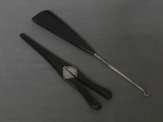 A pair of ebony and silver mounted glove stretchers together with an ebony shoe horn 