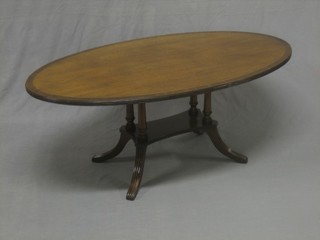 A Georgian style oval inlaid mahogany occasional table, raised on 4 turned columns with platform base and splayed feet 47"