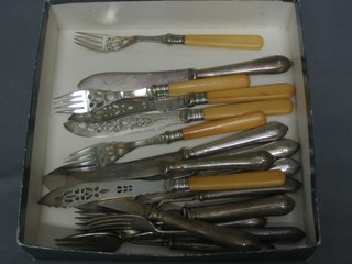 A set of 6 silver plated fish knives and forks and a set of 3 pierced silver plated fish knives and forks