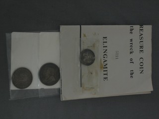 A silver shilling covered from the wreck of Elingamite, a Victorian 1887 florin and a South African 1897 2 shilling piece