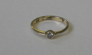 A gold dress ring set a solitaire diamond