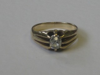 A gentleman's 9ct gold gypsy ring set a diamond
