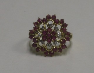 A lady's yellow gold pierced dress ring set rubies and diamonds