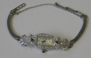 A lady's Abra Watch Co Swiss cocktail wristwatch  with rectangular dial contained in a white gold case set sapphires and diamonds 