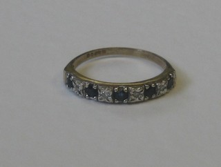A 9ct white gold half eternity ring set sapphires and diamonds