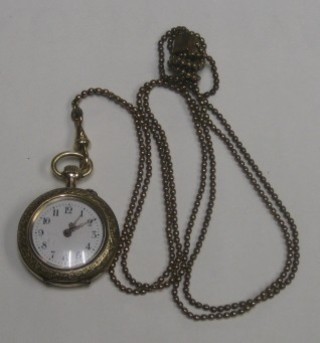 A lady's gilt metal open faced fob watch hung on a gilt chain