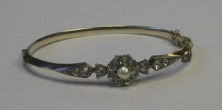 A lady's "gold" bracelet set diamonte and a simulated pearl  