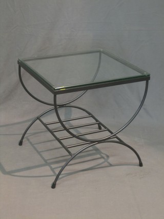 A square iron framed designer lamp table raised on X framed supports with plate glass top 20" 