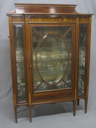 An Edwardian inlaid mahogany display cabinet with raised back, the interior fitted adjustable shelves enclosed by astragal glazed panelled doors, raised on square tapering supports 42"