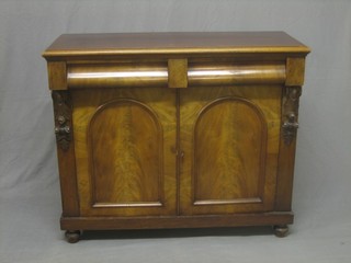 A Victorian mahogany chiffonier fitted 2 drawers above a double cupboard enclosed by arch shaped panelled doors, raised on a platform base 42"