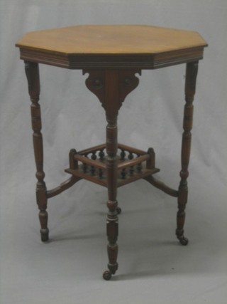 An Edwardian octagonal walnut occasional table with undertier, raised on turned supports