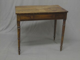 A 19th Century rectangular mahogany side table fitted a drawer raised on turned supports 32"