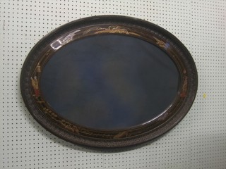 An oval plate mirror contained in a walnut frame with chinoiserie decoration