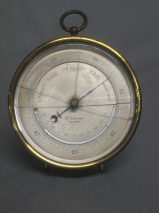 An aneroid barometer and thermometer by C Johnson of Newark 5" (glass cracked)
